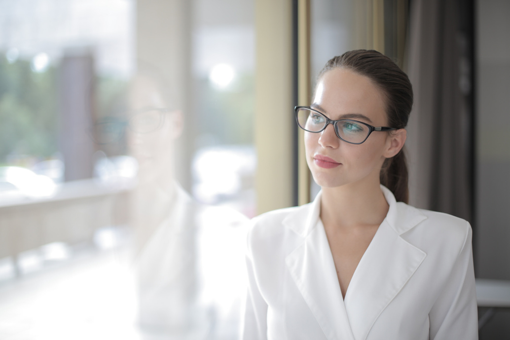 Woman In White Blazer Wearing Black Framed Eyeglasses